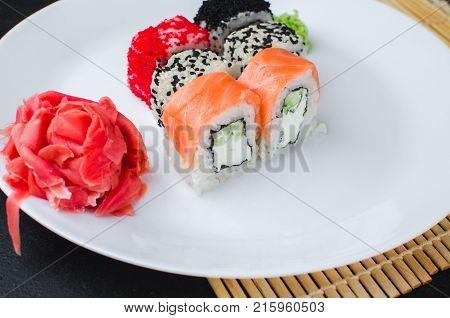 On The Plate Is White, Lined With Different Rolls, Sushi