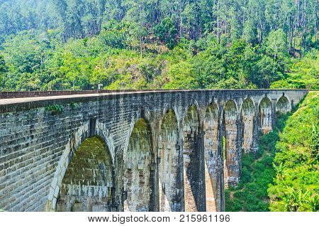 The scenic stone Nine Arch Bridge is hidden in gorge among the forests and agricultural lands of Demodara Ella Sri Lanka.