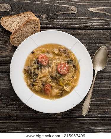 Slovak christmas cabbage soup with mushrooms on natural background.