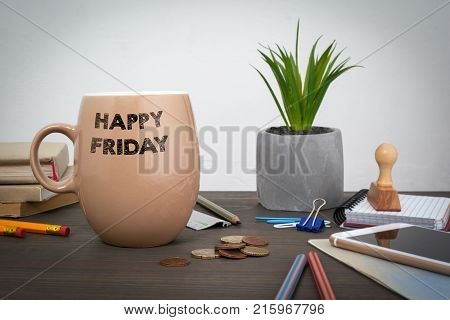 Happy Friday. Business and a success background. Coffee mug on a wooden table