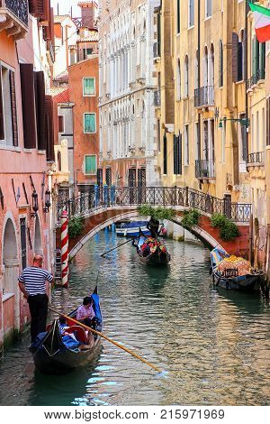 Venice, Italy-june 21: Unidentified People Ride In Gondola In Narrow Canal On June 21, 2015 In Venic