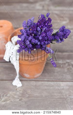 A bunch of freshly cutted Lavender on the wooden background. Vintage. Selective focus.