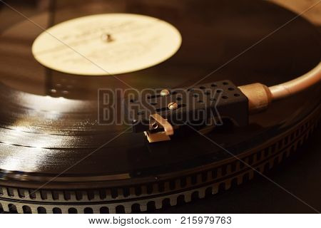 retro vinyl record on the player nostalgia and warm background
