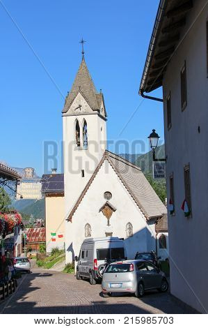 Italy Rocca Pietore - August 26 2016: the view of the typical white house with flowers in Rocca Pietore on August 26 2016 Veneto Italy.