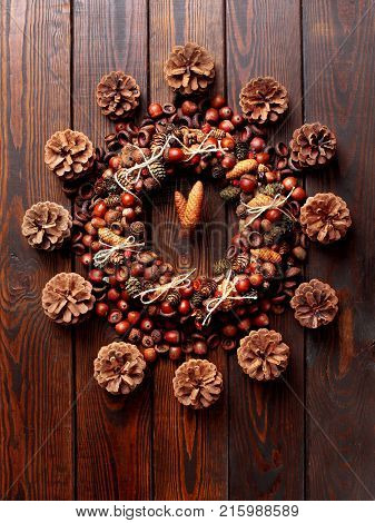 Christmas Closck Made Of Wreath Of Acorns And Cones And Dog Rose On The Wooden Background.ceative Cl