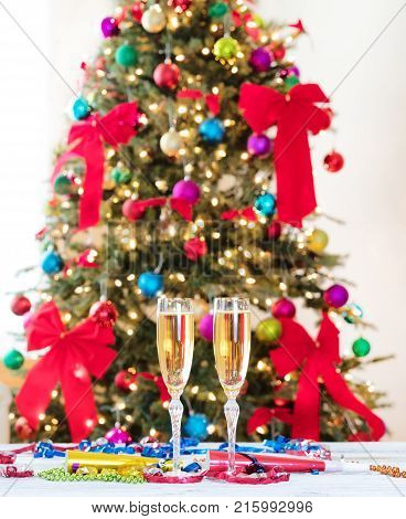 New Year party objects with Christmas tree in background