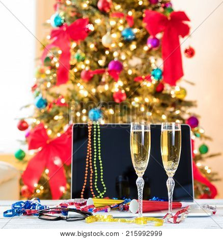 Yearend party at the workplace with New Year and Christmas decorations on desktop