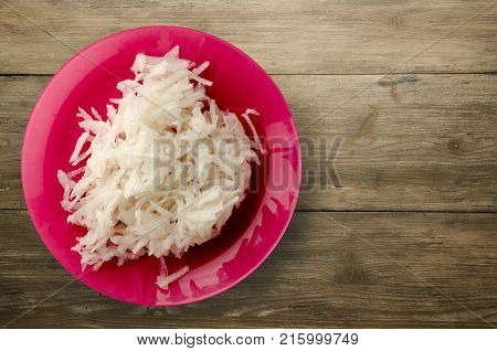 Daikon On A Wooden Background