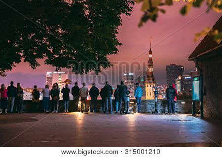 Tallinn, Estonia - July 2, 2019: People Visiting Kohtuotsa Viewing Platform. Cityscape Skyline At Su