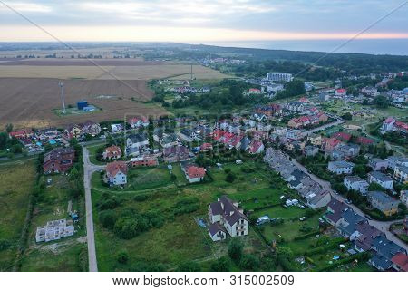 Drone Aerial Perspective View On Colorful Housing Estate In Touristic Mielno City At Baltic Sea.