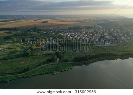 Drone Aerial Perspective View On Housing Estate In Touristic Mielno City At Jamno Lake During Sunset