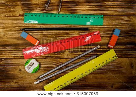 Set Of School Stationery Supplies On Wooden Desk. Top View