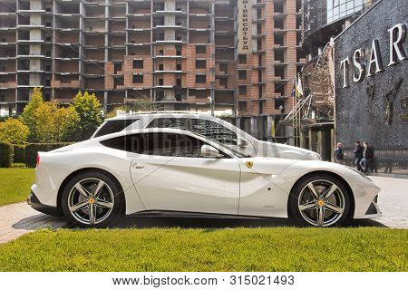 Kiev, Ukraine - May 3, 2019: White Ferrari F12 Berlinetta In The City