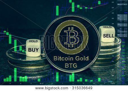 The Coin Cryptocurrency Bitcoin Gold Btg Stack Of Coins And Dice. Exchange Chart To Buy, Sell, Hold.