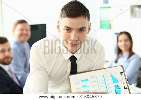 Portrait Of Smart Manager Sitting In Big Modern Office Building And Showing Important Business Proje