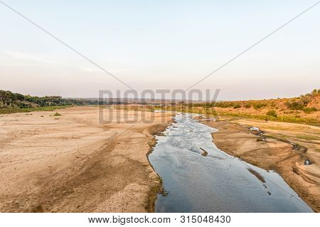 View Of The Letaba River At Sunset As Seen From The Road Bridge On Road H1-6