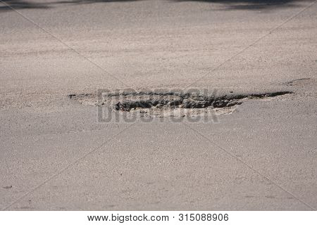 Bad Roads. Hole In The Asphalt, The Risk Of Movement By Car, Bad Asphalt, Dangerous Road, Potholes I