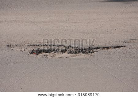 Bad Roads. Hole In The Asphalt, The Risk Of Movement By Car, Bad Asphalt, Dangerous Road, Potholes I
