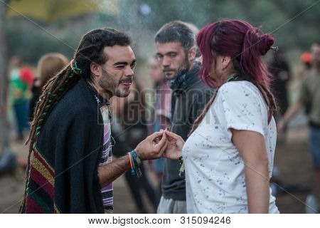 Riomalo De Abajo, Extremadura, Spain - July 15, 2018: A Young Man Shares A Joint With A Girl On The 