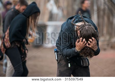 Riomalo De Abajo, Extremadura, Spain - July 15, 2018: A Man Untangle His Hair At The Lost Theory Psy