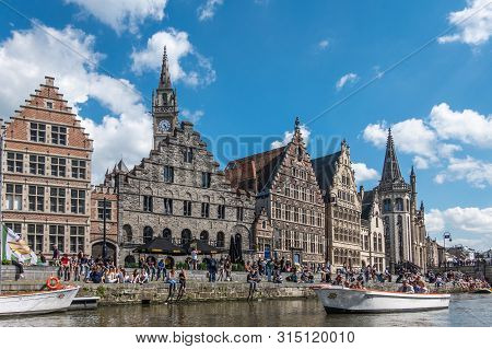 Gent, Flanders, Belgium -  June 21, 2019: School Children And Students Enjoying Sun Sitting On Quay 