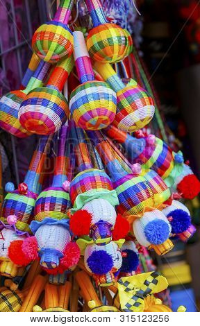 Colorful Blue Yellow Straw Toys Rattles Oaxaca Mexico.  Oaxaca Has Famous Handicrafts