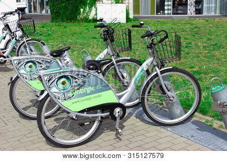 Poland, Belostok - July 13, 2019. Bicycles Are At The Station. Urban Ecological Transport For Hire. 