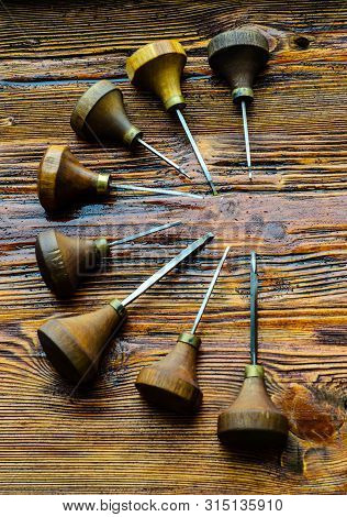 Different Gravers For Jewelry On A Wooden Background