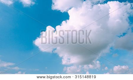 Beautiful Bright Blue Sky With White Fluffy Clouds On A Clear Sunny Day. Royalty High-quality Free S