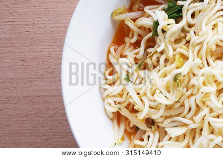 Close Up Dry Tomyum Noodle On Wooden Table