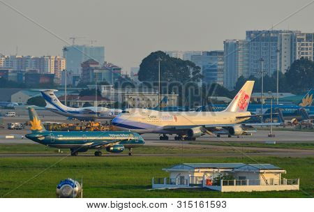 Saigon, Vietnam - Jul 10, 2019. Passenger Airplanes Taxiing On Runway Of Tan Son Nhat Airport (sgn) 