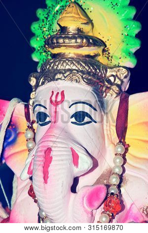 Hindu God Ganesha. Ganesha Idol On Black Background, Photo Taken In India.