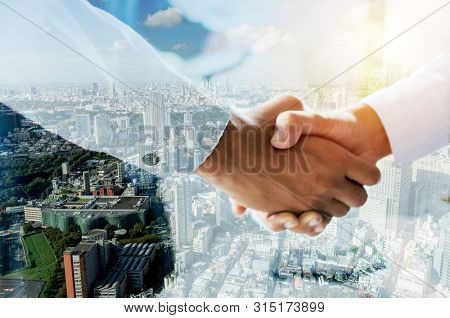 Partnership. Double Exposure Image Of Investor Business Man Handshake With Partner For Successful Me