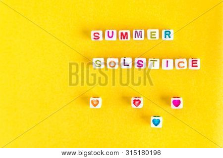 Phrase Summer Solstice Made Out Of Beads On Bright Yellow Sunny Background