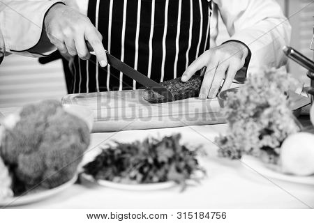 At Work. Chef Man In Apron. Secret Taste Recipe. Vegetarian. Bearded Man Cook In Kitchen, Culinary. 