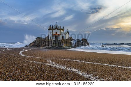 Sunset View On Capella Do Senhor Da Pedra At The Atlantic Ocean