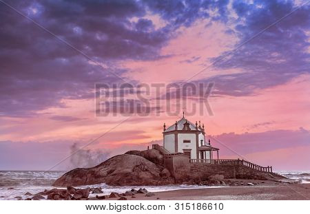 Sunset View On Capella Do Senhor Da Pedra At The Atlantic Ocean