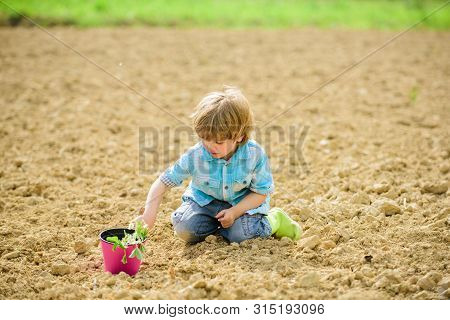 Happy Child Gardener. Botanic Worker. Spring Season. Earth Day. New Life. Summer Farm. Small Kid Pla