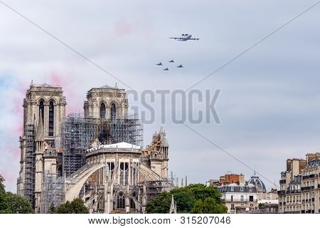 Paris, France - July 14 2019: Bastille Day Aircrafts Parade Over Notre Dame De Paris - This Is An Aw