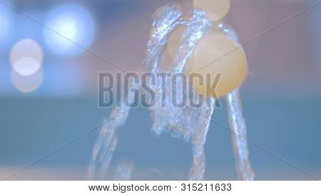 Tennis Ball On Jet Of Water. Science, Physics And Hydrodynamic Concept