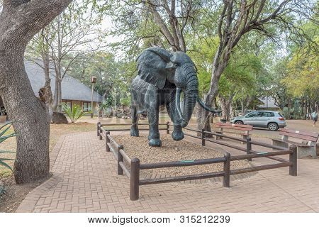 Kruger National Park, South Africa - May 7, 2019: View Of The Letaba Rest Camp. A Life-size Elephant