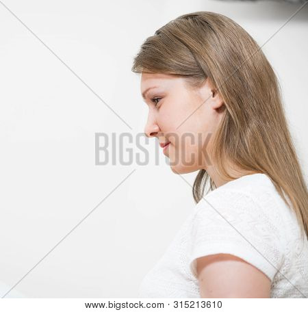 Profile Portrait Of Beautiful Caucasian Woman. Close Up Healthy Young Woman With Long Hair. Fair Hai