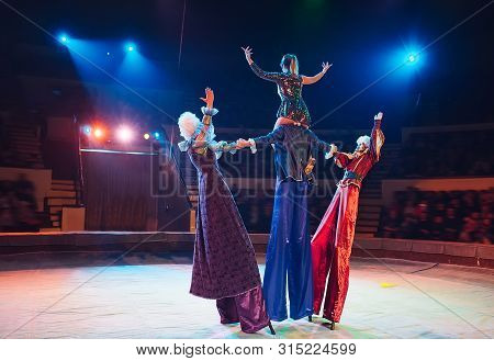 The Performance Of Stilt-walkers In The Circus