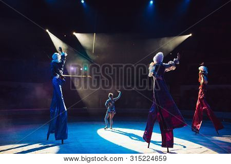 The Performance Of Stilt-walkers In The Circus