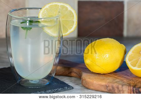 Lemon Drink. Authentic Home-made Lemonade. Cool Refreshing Summer Beverage. Glass With Freshly Squee