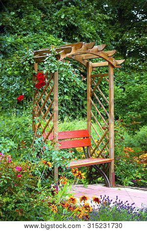Beautiful Wooden Alkove In Green Summer Garden With Bright Flowers. For Wallpaper And Design, Garden