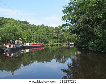 Traditional Barges Moored On The Rochdale Canal Surrounded By Calder Valley Countryside Near Hebden 