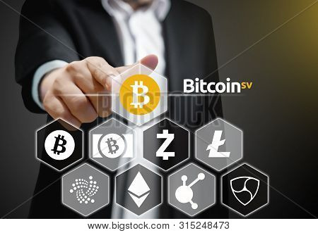 Concept Of A Business Man Pointing At Bitcoin Sv Coin, A Cryptocurrency Blockchain Platform , Digita