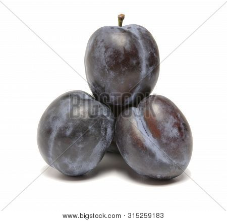 Ripe Beautiful Plums On A White Background