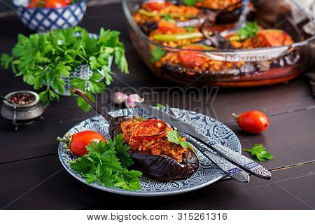 Karniyarik - Turkish Traditional Aubergine Eggplant Meal. Stuffed Eggplants With Ground Beef And Veg